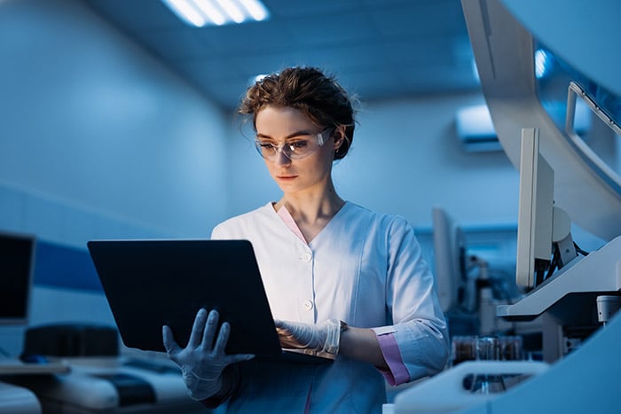 Woman portrait, scientist in lab, chemical engineer and forensics Using Computer. 