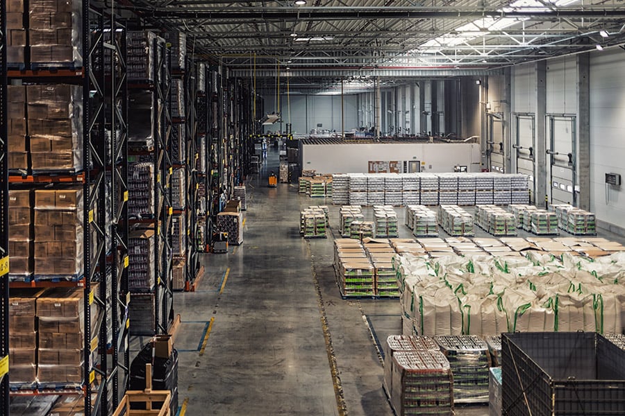 Huge distribution warehouse with high shelves, view from above