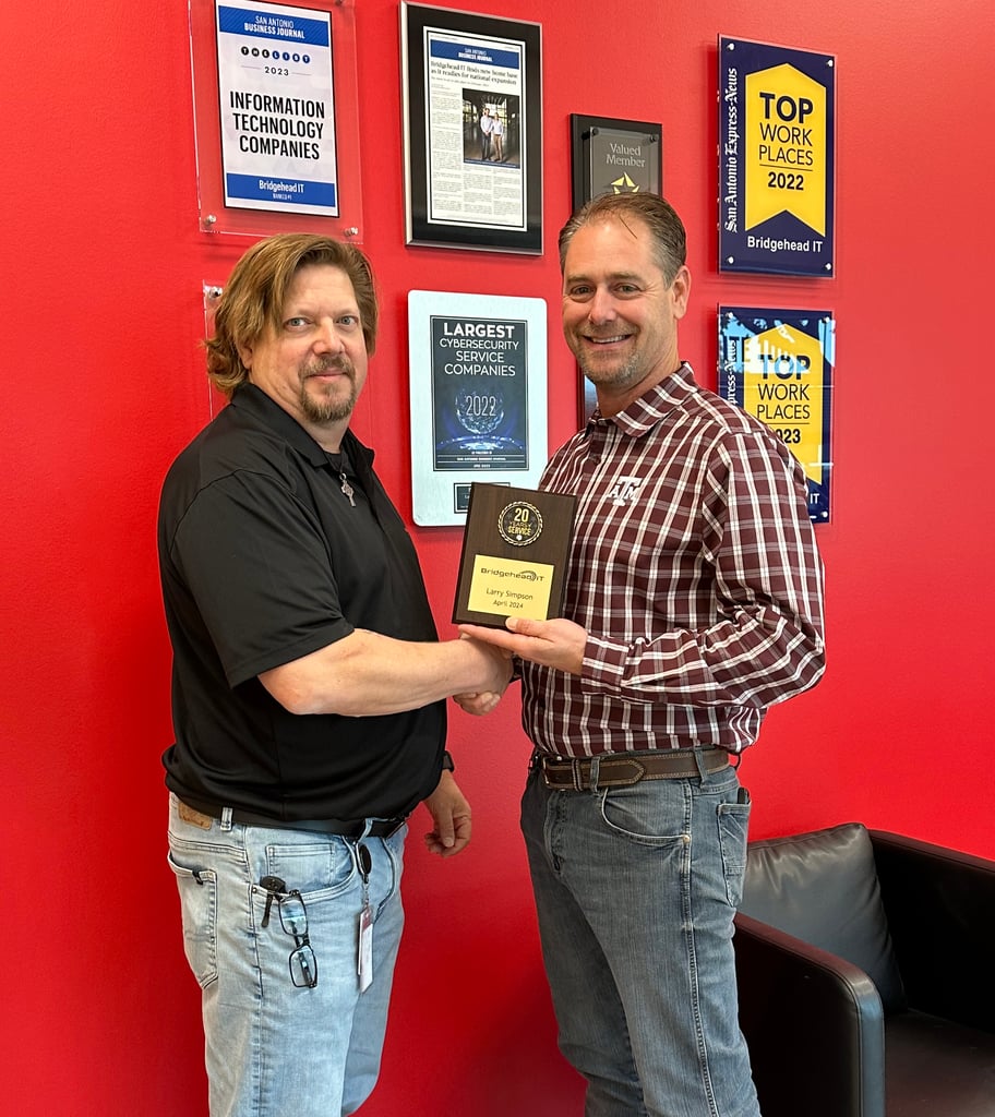 Larry Simpson receiving his 20 year recognition alongside Bridgehead IT COO, Chris Brandvik. 