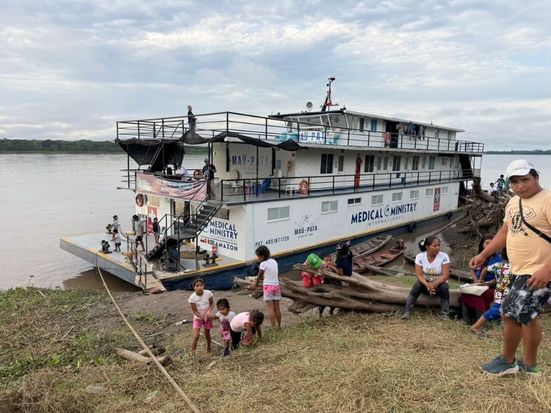 Medical volunteers aboard a floating clinic on the Amazon River serving communities in Colombia and Peru.